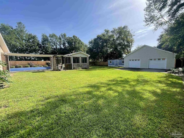 view of yard with an outbuilding and a garage