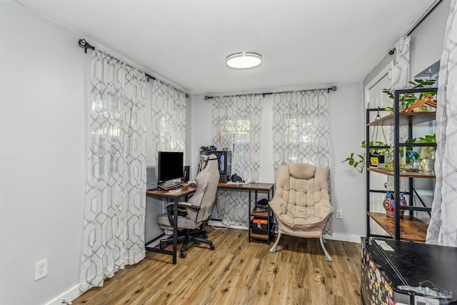 office area with light hardwood / wood-style flooring