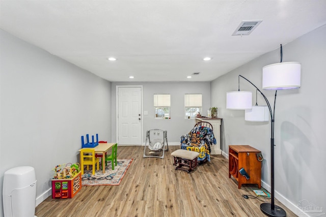 rec room with light wood-type flooring