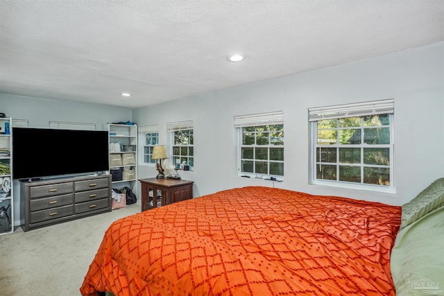 bedroom featuring a textured ceiling and carpet floors