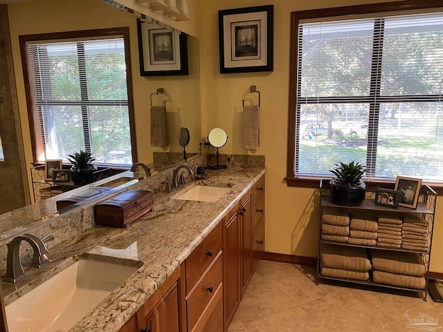 bathroom with tile patterned flooring and vanity