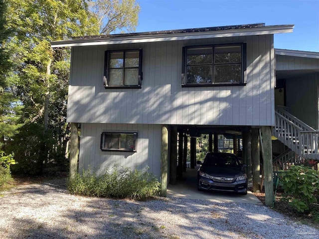 view of front of property featuring a carport