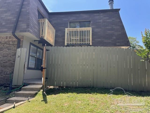 2301 W Michigan Ave Unit 25, Pensacola, FL 32526 - view of property exterior with brick siding and a balcony