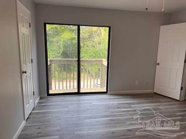 2301 W Michigan Ave Unit 25, Pensacola, FL 32526 - spare room with baseboards and wood finished floors