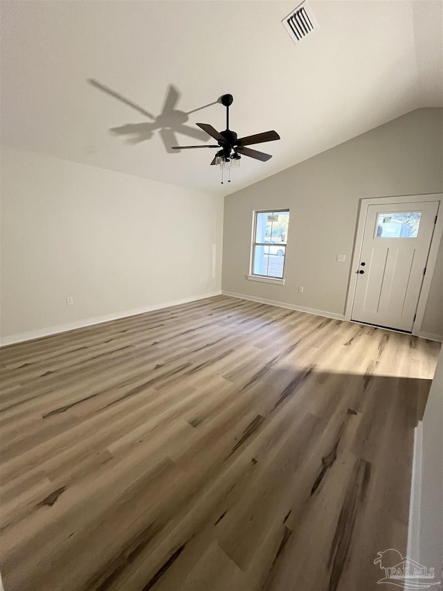 interior space featuring wood-type flooring and lofted ceiling