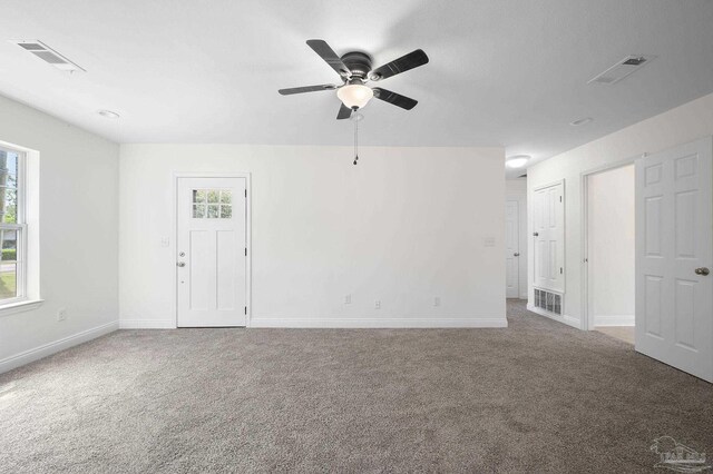 carpeted empty room with ceiling fan