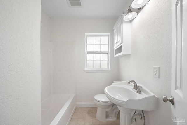 bathroom featuring visible vents, baseboards, toilet, and tile patterned flooring