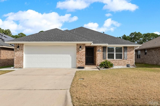 view of front of property with a garage and a front yard