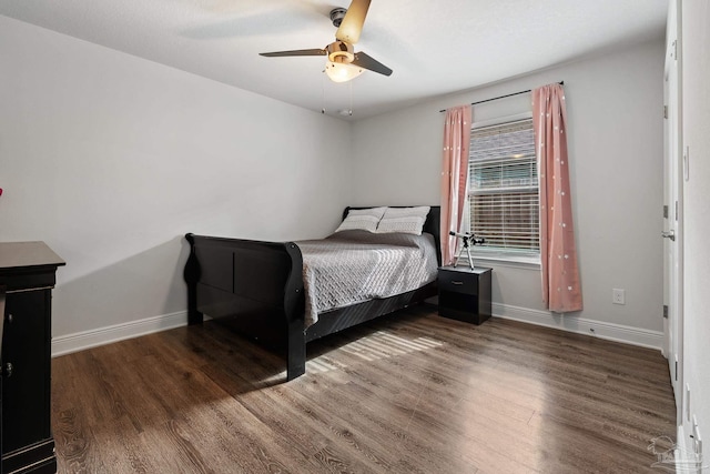 bedroom featuring dark hardwood / wood-style flooring and ceiling fan