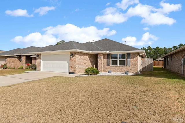 view of front of home with a front yard and a garage