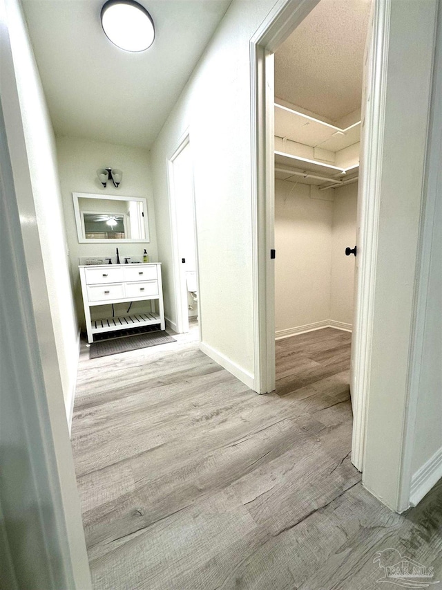 hallway featuring light hardwood / wood-style flooring