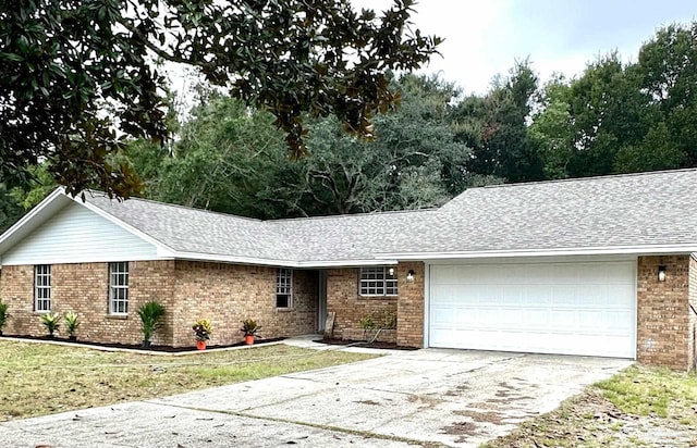 single story home featuring a garage