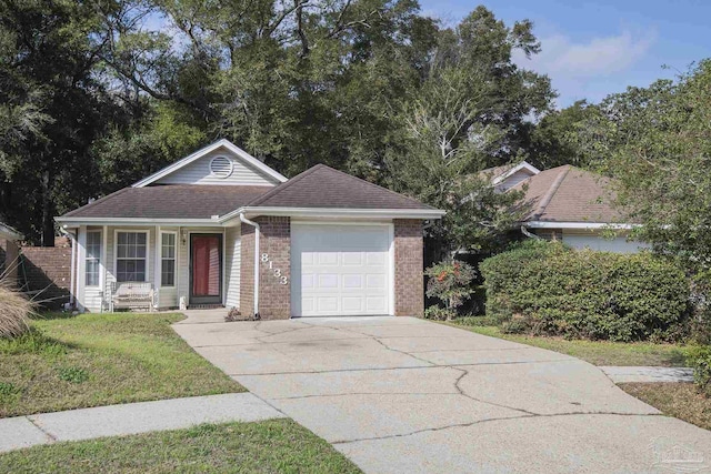 view of front facade with a garage and a front yard