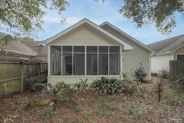 back of house with a sunroom