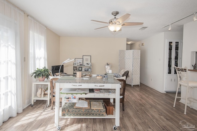 dining space featuring hardwood / wood-style floors and ceiling fan