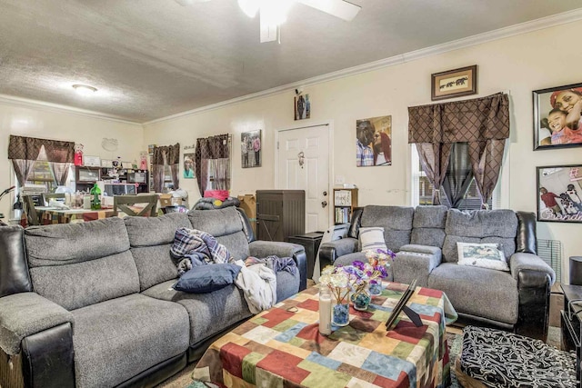 living room featuring crown molding, a textured ceiling, and ceiling fan