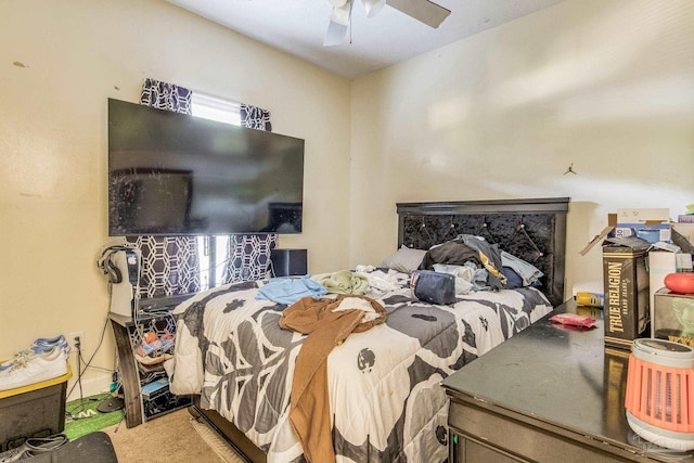 carpeted bedroom with multiple windows and ceiling fan