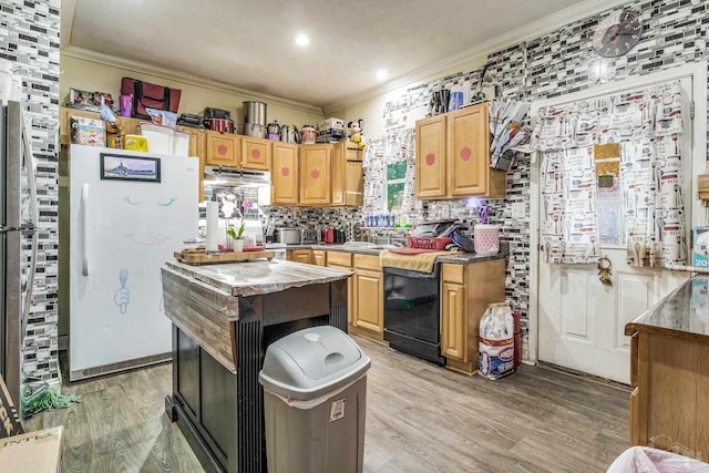 kitchen featuring light brown cabinets, ornamental molding, white refrigerator, light hardwood / wood-style floors, and tasteful backsplash