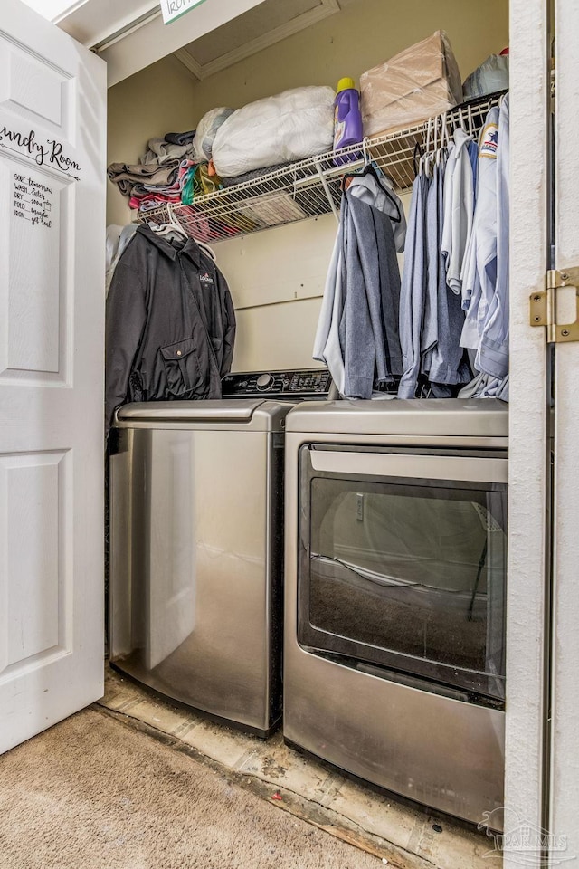 clothes washing area with carpet and separate washer and dryer