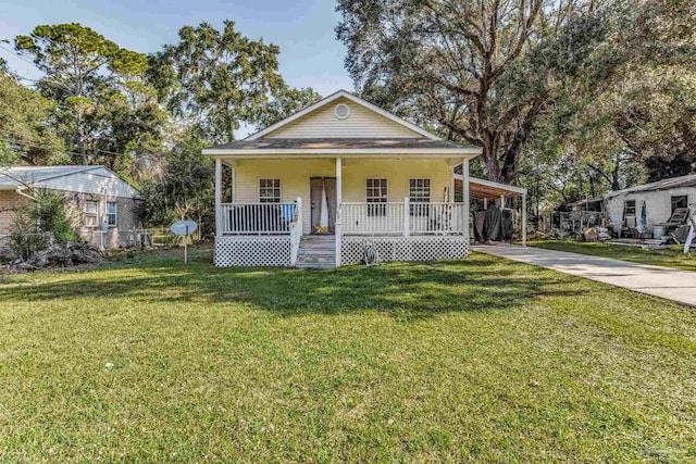 bungalow-style home featuring a carport, a front yard, and a porch