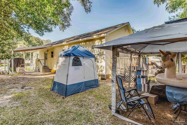 view of side of home with a gazebo