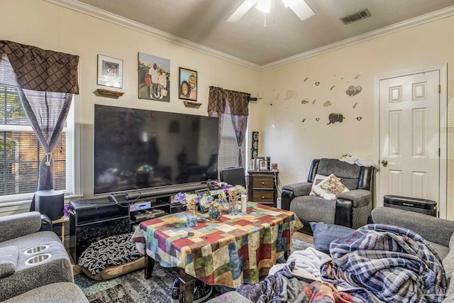 living room featuring ornamental molding and ceiling fan