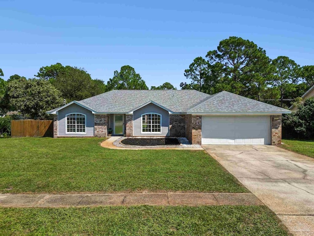 single story home with a front yard and a garage