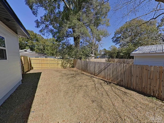 view of yard featuring a fenced backyard