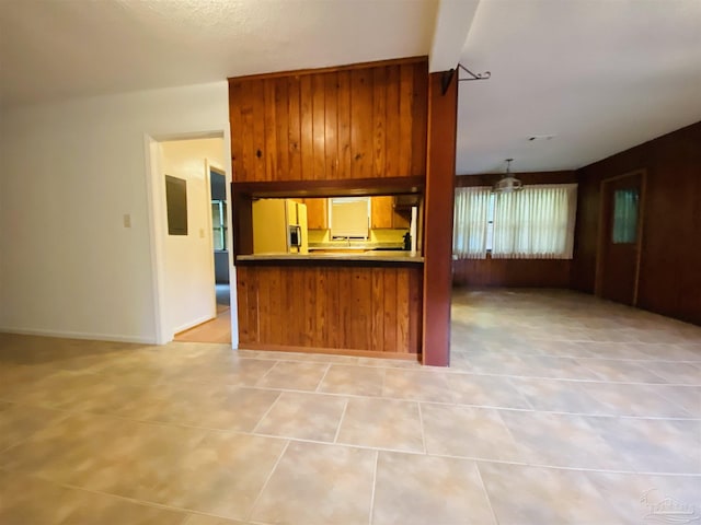 unfurnished living room featuring a stone fireplace