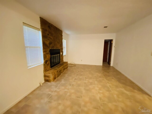 carpeted spare room featuring a wealth of natural light