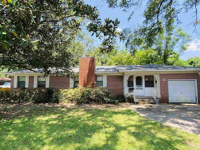 ranch-style house with a garage and a front lawn