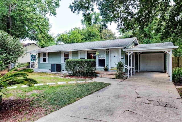 ranch-style house with a porch, concrete driveway, central AC unit, a carport, and an attached garage