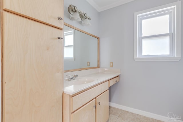 bathroom with baseboards, vanity, and tile patterned flooring