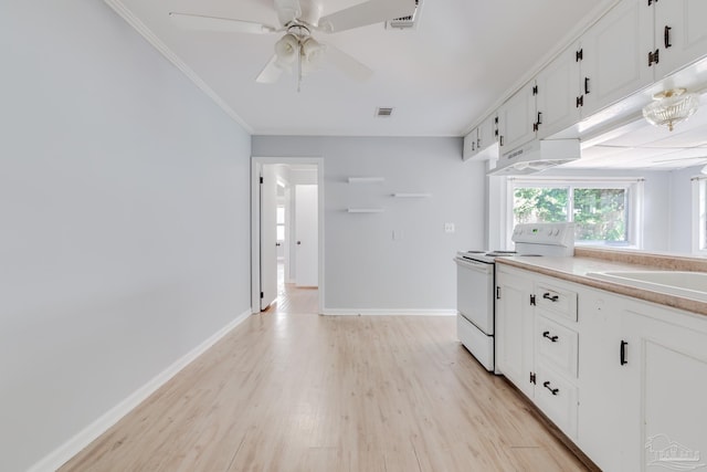 kitchen featuring crown molding, baseboards, electric stove, light wood-style floors, and white cabinetry