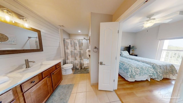 bathroom featuring visible vents, a ceiling fan, toilet, ensuite bathroom, and curtained shower