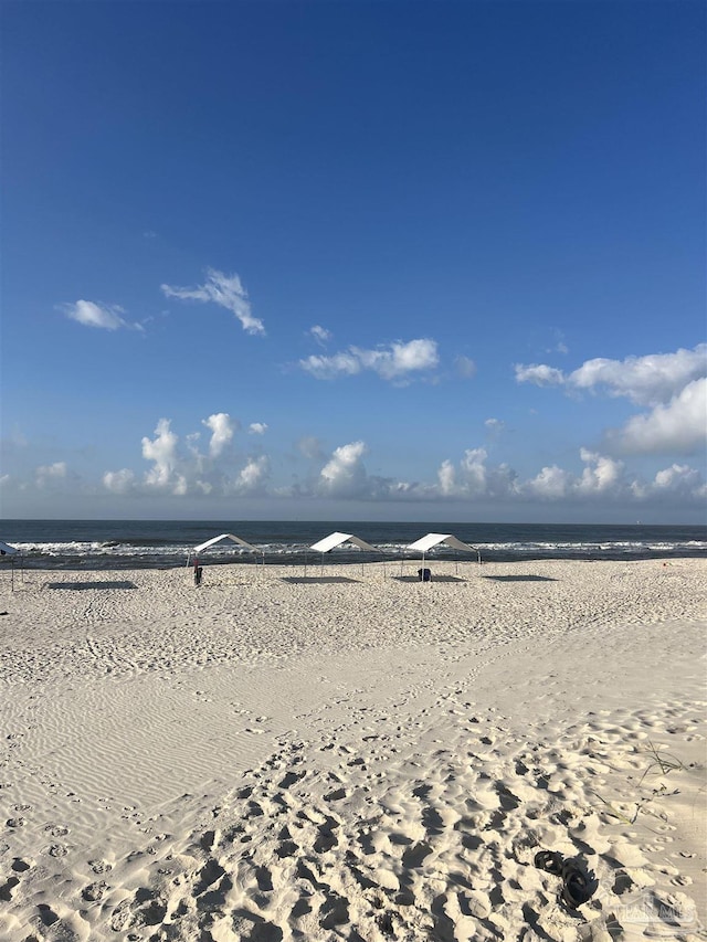 property view of water featuring a beach view