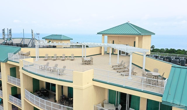 exterior space featuring a water view and a patio area