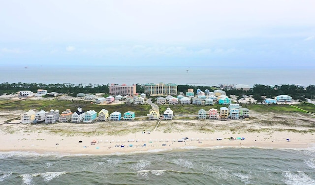 birds eye view of property featuring a city view, a water view, and a beach view