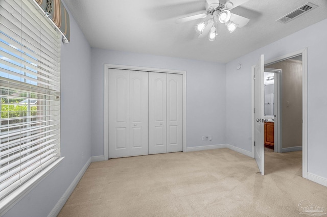1061 Black Walnut Trl, Pensacola, FL 32514 - unfurnished bedroom with light carpet, baseboards, and a closet
