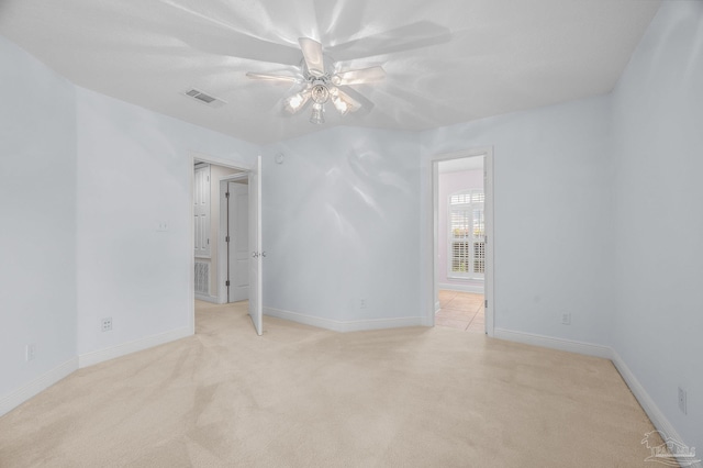 1061 Black Walnut Trl, Pensacola, FL 32514 - spare room featuring light colored carpet, ceiling fan, and baseboards