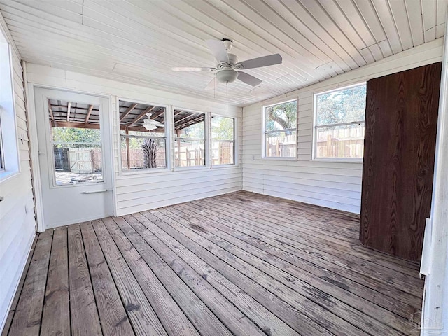 unfurnished sunroom featuring wooden ceiling and a ceiling fan