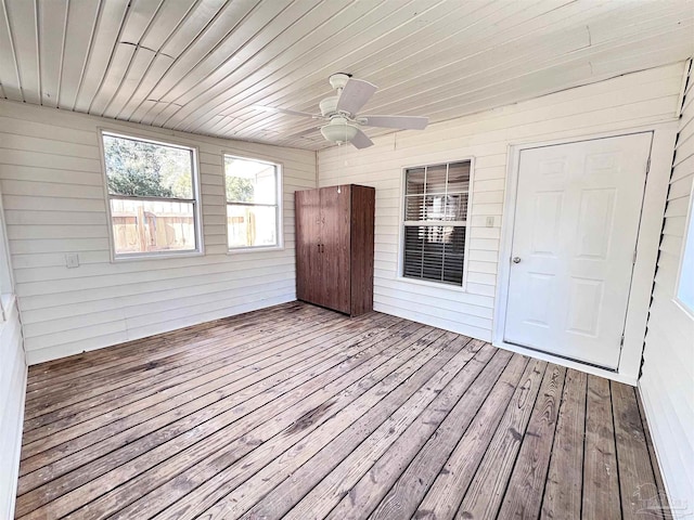 wooden terrace featuring ceiling fan