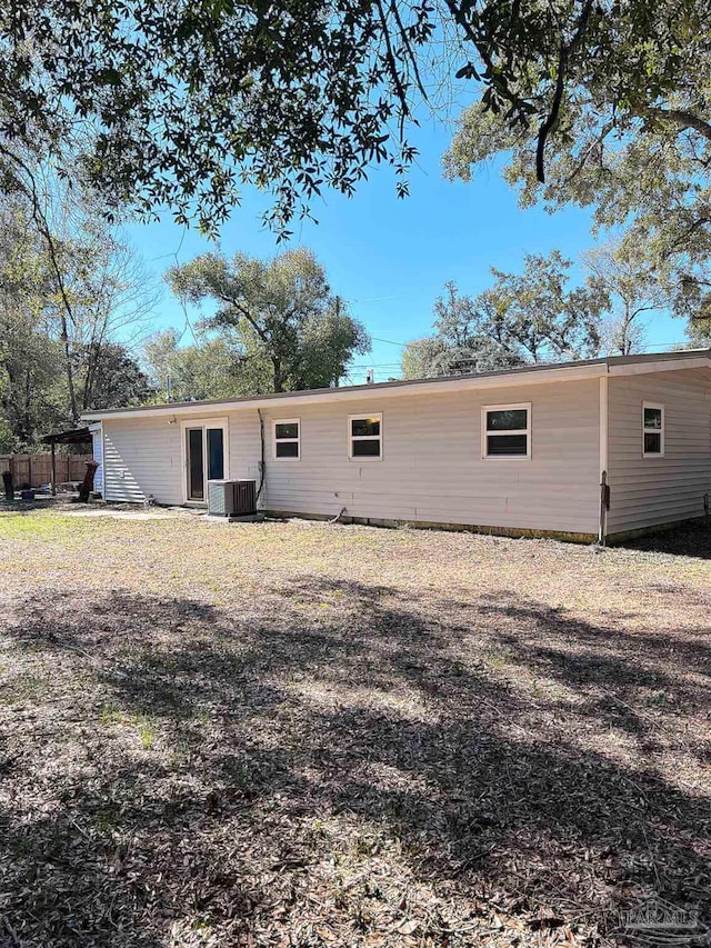 back of property featuring cooling unit