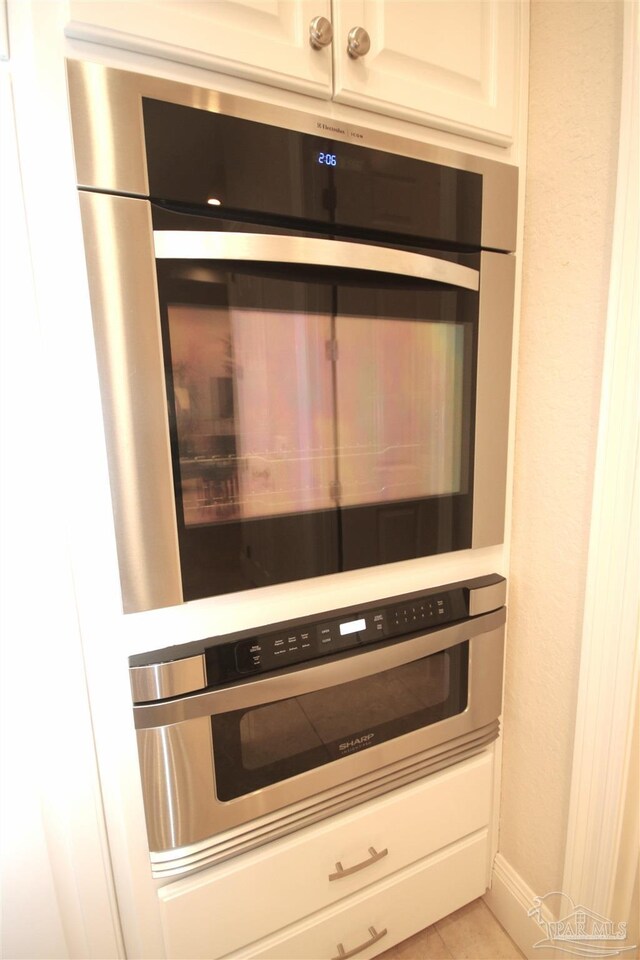 room details with stainless steel oven and wall oven