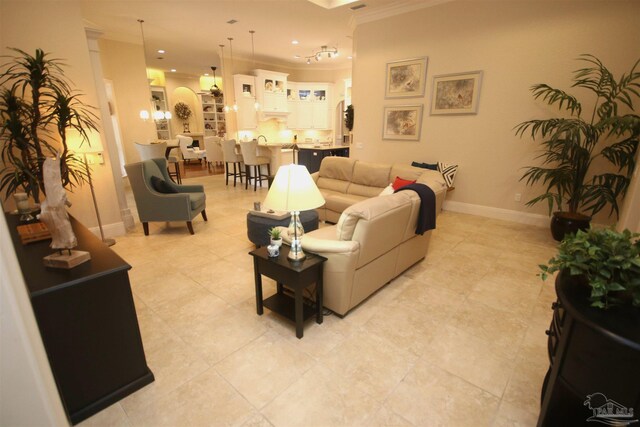 living area with recessed lighting, crown molding, baseboards, and light tile patterned floors