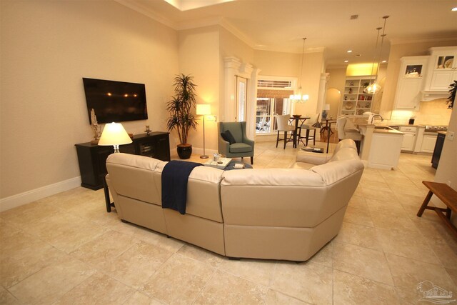 living room featuring crown molding, light tile patterned floors, an inviting chandelier, baseboards, and recessed lighting