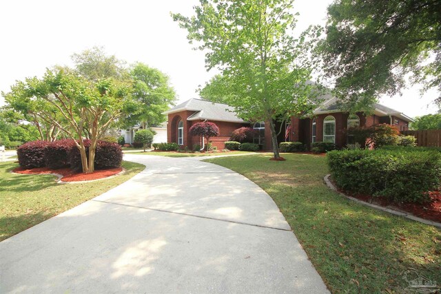 view of front of property with driveway and a front yard