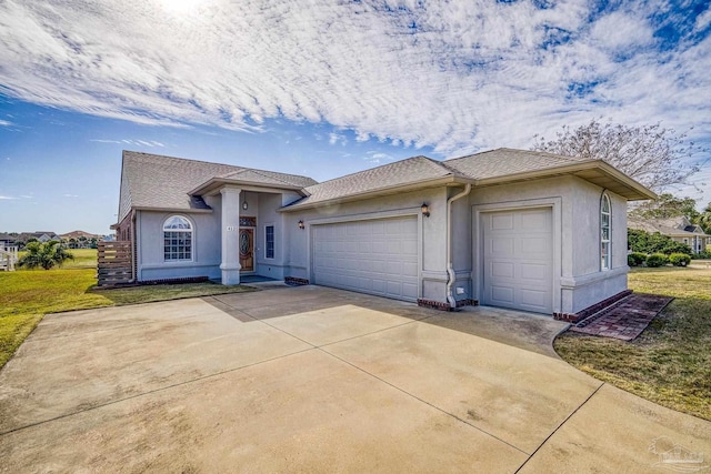 single story home featuring a front yard and a garage