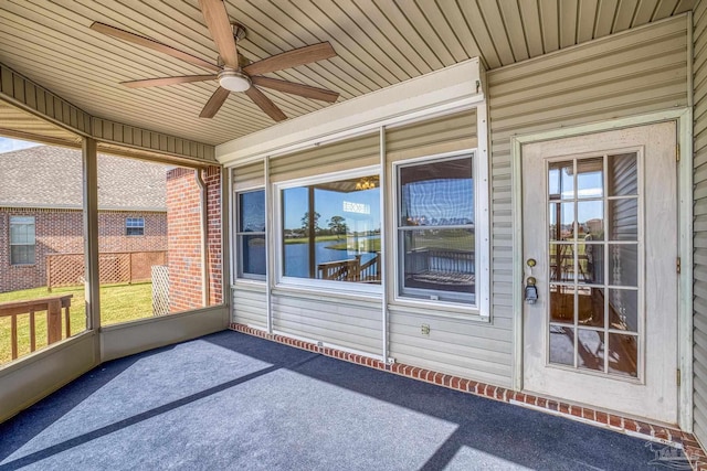 unfurnished sunroom with ceiling fan and wood ceiling