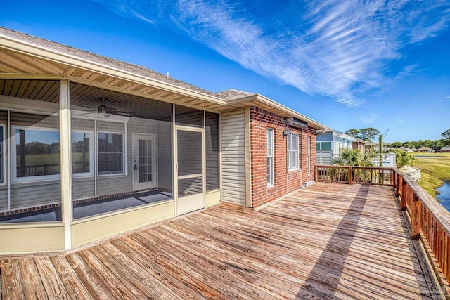 deck featuring ceiling fan and a sunroom